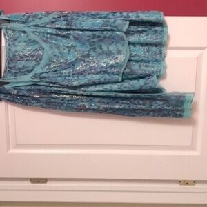 Beautiful fancy fashionable 3 piece skirt and sleeveless top plus scarf.